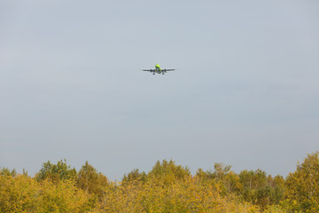 Fototapeta na wymiar Bottom view airplane takeoff to the sky