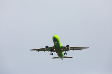 Bottom view airplane takeoff to the sky