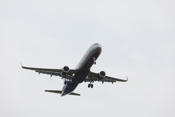 Bottom view airplane takeoff to the sky. the rise of the real aircraft in the sky.