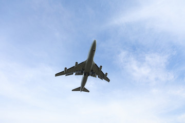 Bottom view airplane takeoff to the sky. the rise of the real aircraft in the sky.