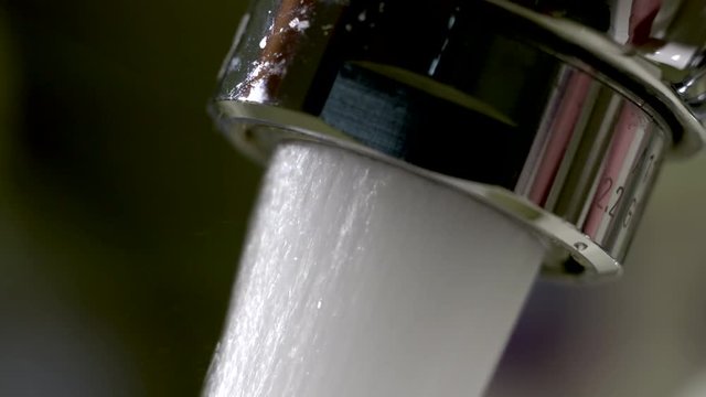 Close up shot of water flowing from the tap