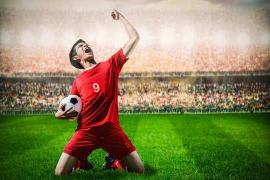 Striker Soccer Football Player In Red Team Concept Celebrating G