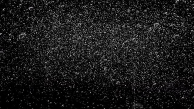 A black background of extra soda bubble fizz with last 10 seconds loop at end.