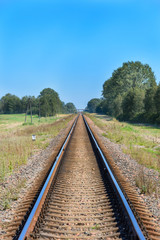 Obraz premium Railroad tracks stretching into the distance.
