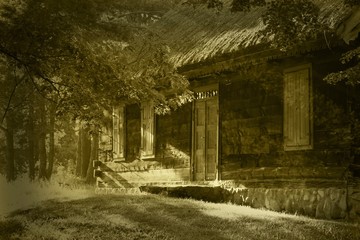 Fototapeta na wymiar old wooden house in sepia