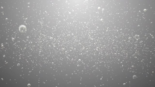 A silver background of sparse soda bubble fizz with last 10 seconds loop at end.