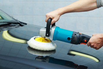 black car is polishing