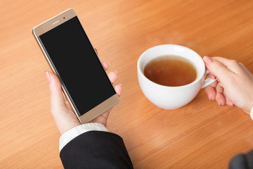 Business woman holding smartphone