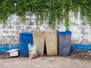 Naklejka premium Garbage bags with food waste at dumpsters