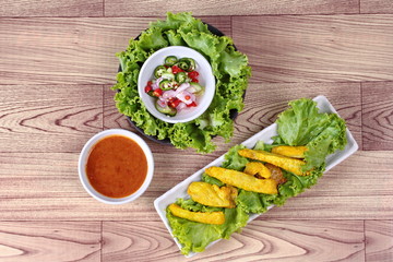 Charcoal boiled pork satay, home made in big size, served with Thai cucumber chili sauce as 