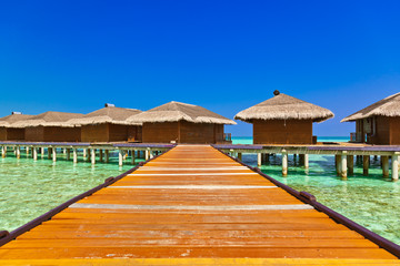 Water bungalows on tropical Maldives island