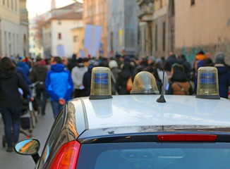 police car escorted the protesters during a street protest