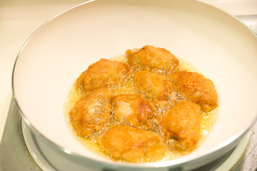 Deep fried chicken in a white pan