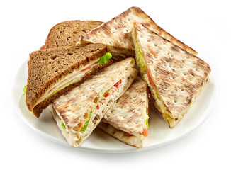 plate of various triangle sandwiches