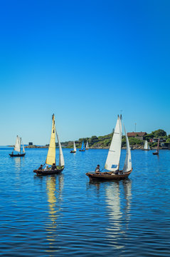 Sailboats in summer sea scenery - vertical view