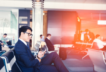 businessman is Doing Business on mobile phone, while is sitting