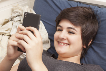 smiling girl with smartphone