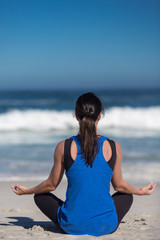 Fototapeta na wymiar yoga on the beach in the morning