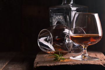 Glass of brandy or cognac and bottle