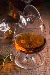 Glass of brandy or cognac and bottle