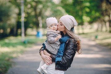 Fototapeta premium young family walking in the park