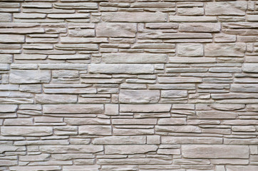 Stone wall or construction material for fence.