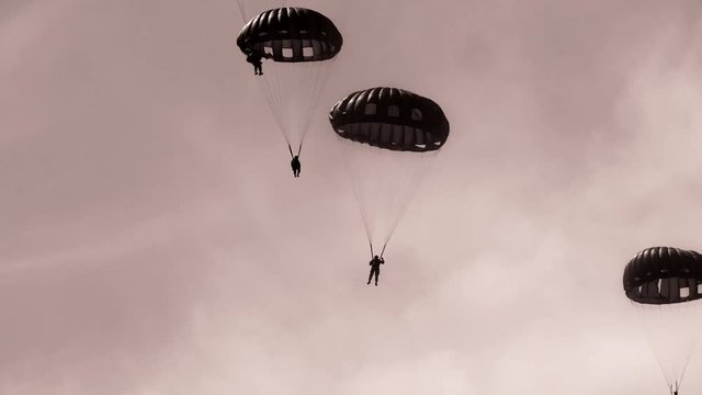 Paratroopers dropping down from the sky