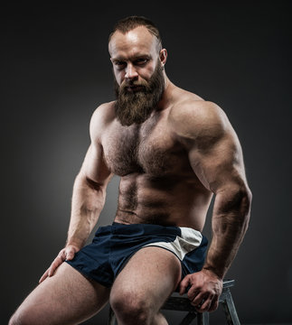 Portrait Of Strong Bearded Man With Perfect Abs, Pecs Shoulders,