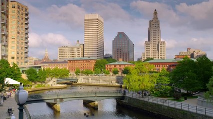 Wide shot of Providence River with city skyline in background