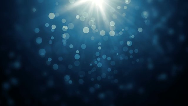  Moving gloss particles on blue background loop. Winter theme Christmas background with snowflakes. On a black background.