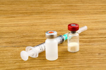 Vaccine and plastic medical syringe