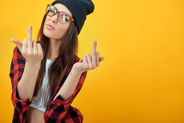 Fashion beauty girl wearing sunglasses, plaid shirt, black beani