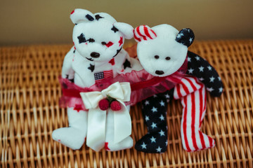 Red garter put over the little toy bears