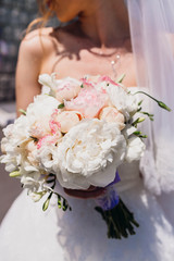 nice and gentle wedding bouquet in the bride's hands