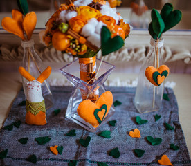 Wedding bouquet made of tangerines and cinnamon stands in the gl