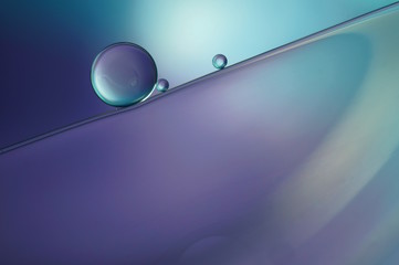 Oil drops on a water surface - abstract macro in blue and purple (435)