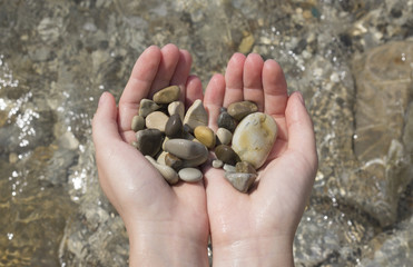 Handful of stones in hands