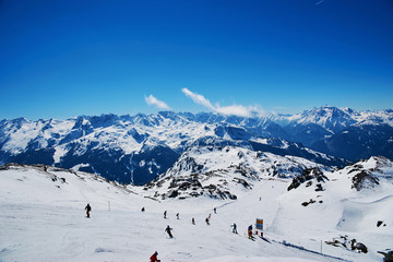Fototapeta na wymiar MAYRHOFEN, AUSTRIA - MARCH 28, 2015 - Slopes and ski lifts at ilpine skiing resort at Mayrhofen, Austria on March 28, 2015