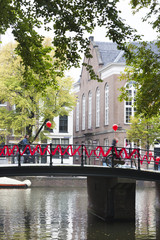 Canal and bridge decorated with red ribbon