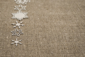 Рождество текстура. Белые снежинки льняная ткань. Зима открытка - obrazy, fototapety, plakaty