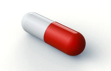 red and white pill capsule isolated on white