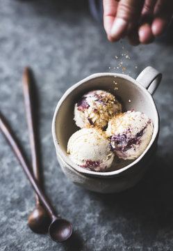 Sprinkiling brown sugar on for fig swirl ice cream.