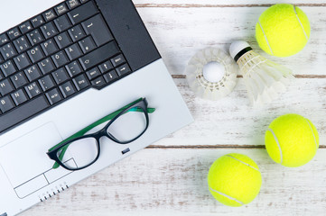 Top view of laptop, Sports Equipment, Tennis ball, Shuttlecock a