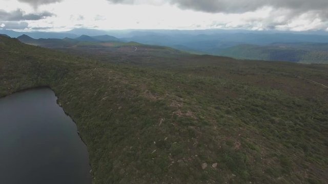 Forward flight passing Lake Esperance at Hartz Mountains National Park, Tasmania, Australia