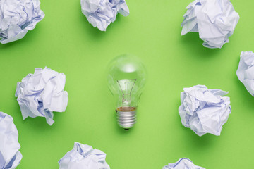 new idea concept with crumpled office paper and light bulb