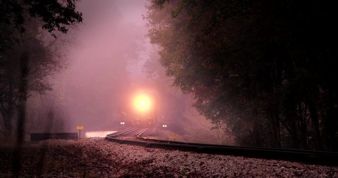 Wide shot of vintage train moving on track