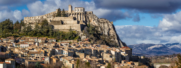 Sisteron rooftops with its Citadel and fortifications (panoramic). Alpes de Haute Provence, Southern Alps, France
