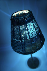 Blue candle lamp with mysterious candlelight and blue background