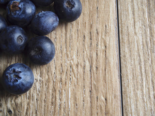 Blueberries on wood background