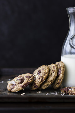 Chocolate chunk cookies with oats, sea salt, and carafe of milk